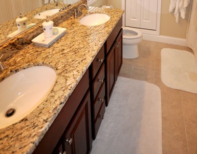 Master Bathroom with granite countertop and dual sinks